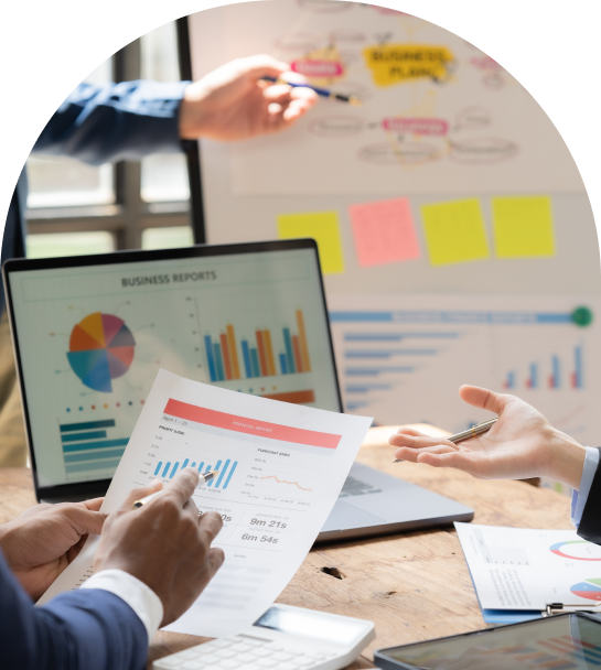 business meeting reviewing documents with charts